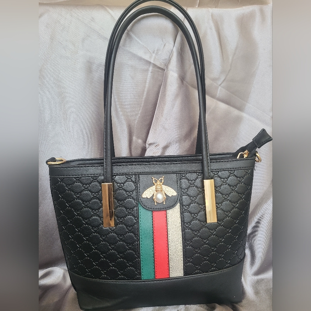 Diophy black leather handbag with quilted stitching.